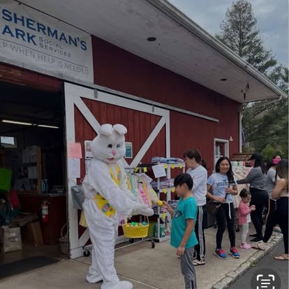 Easter Bunny handing out candy during a Fisherman's Mark holiday distribution