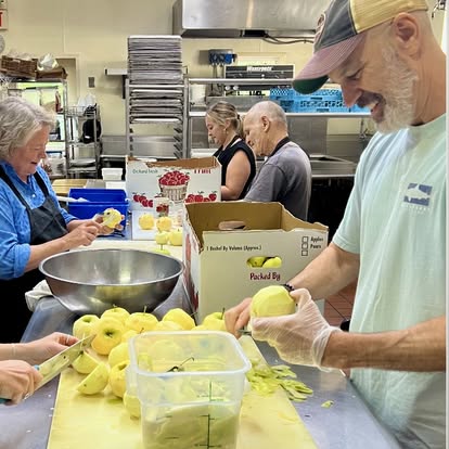 Volunteers preparing food for Fisherman's Mark Zero Waste program